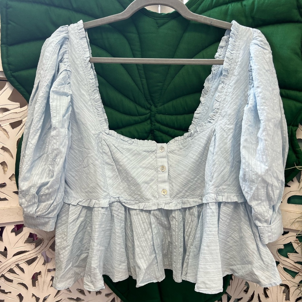 NWOT Free People sky blue colored puff sleeve peplum button front top.